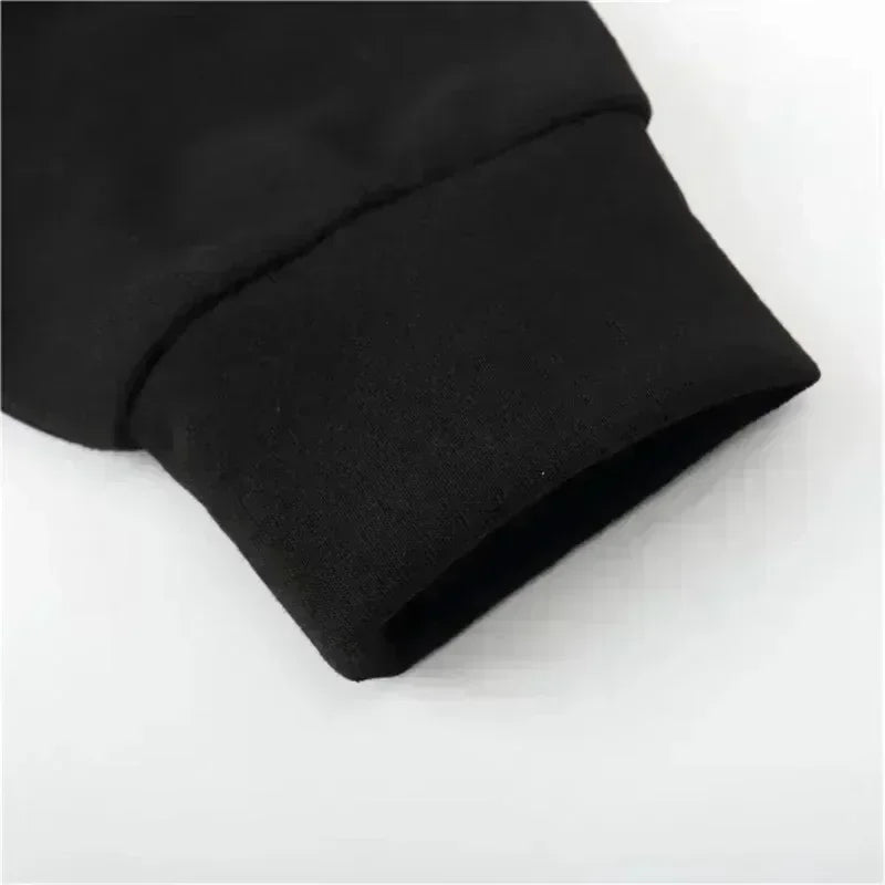 Close-up of the ribbed cuff on the black Solo Leveling No Limit hoodie