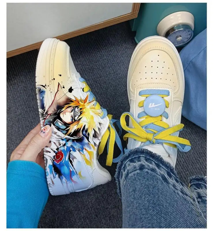 Naruto Minato sneaker held in hand showing side artwork, with front view of the blue and yellow laces